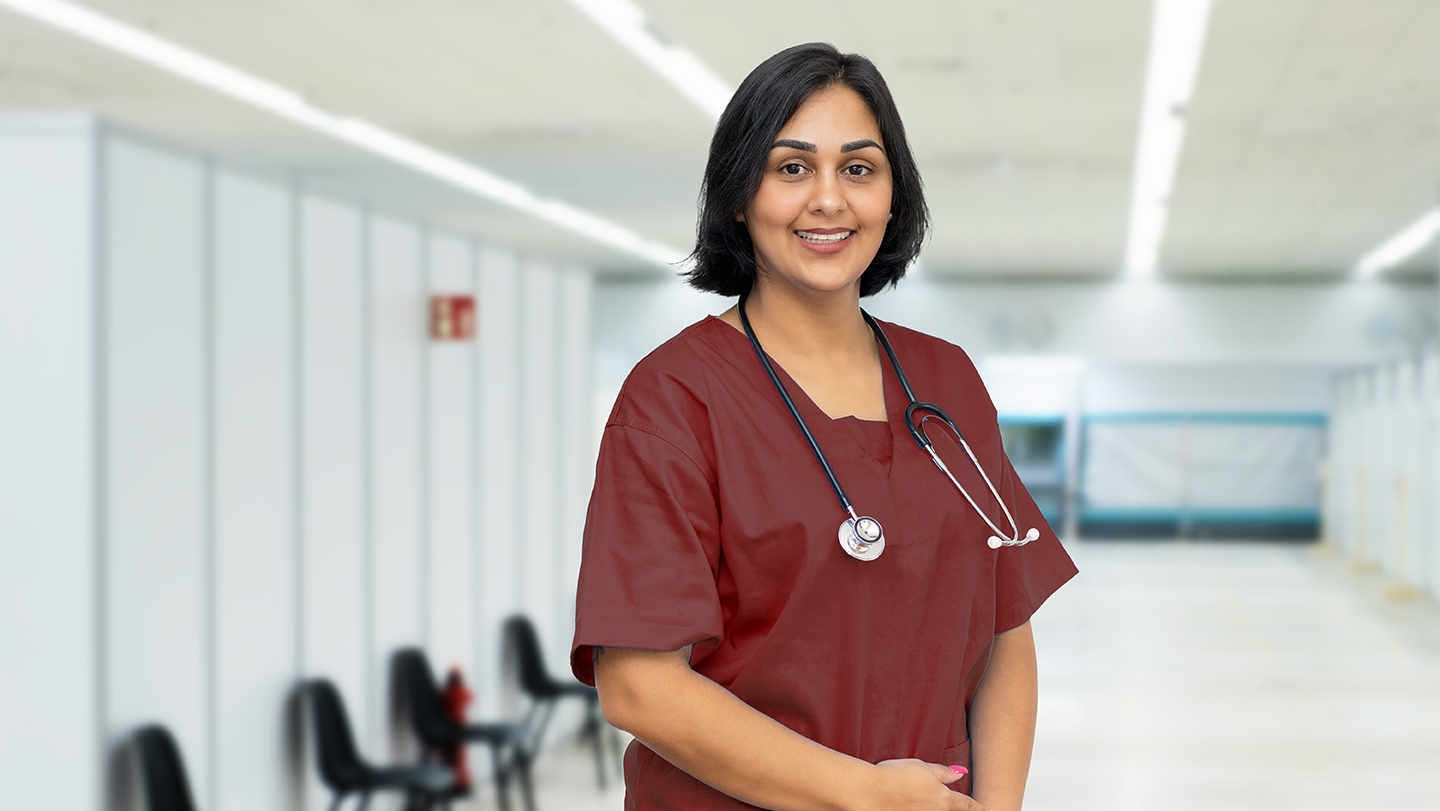 Nurse standing in hospital hallway