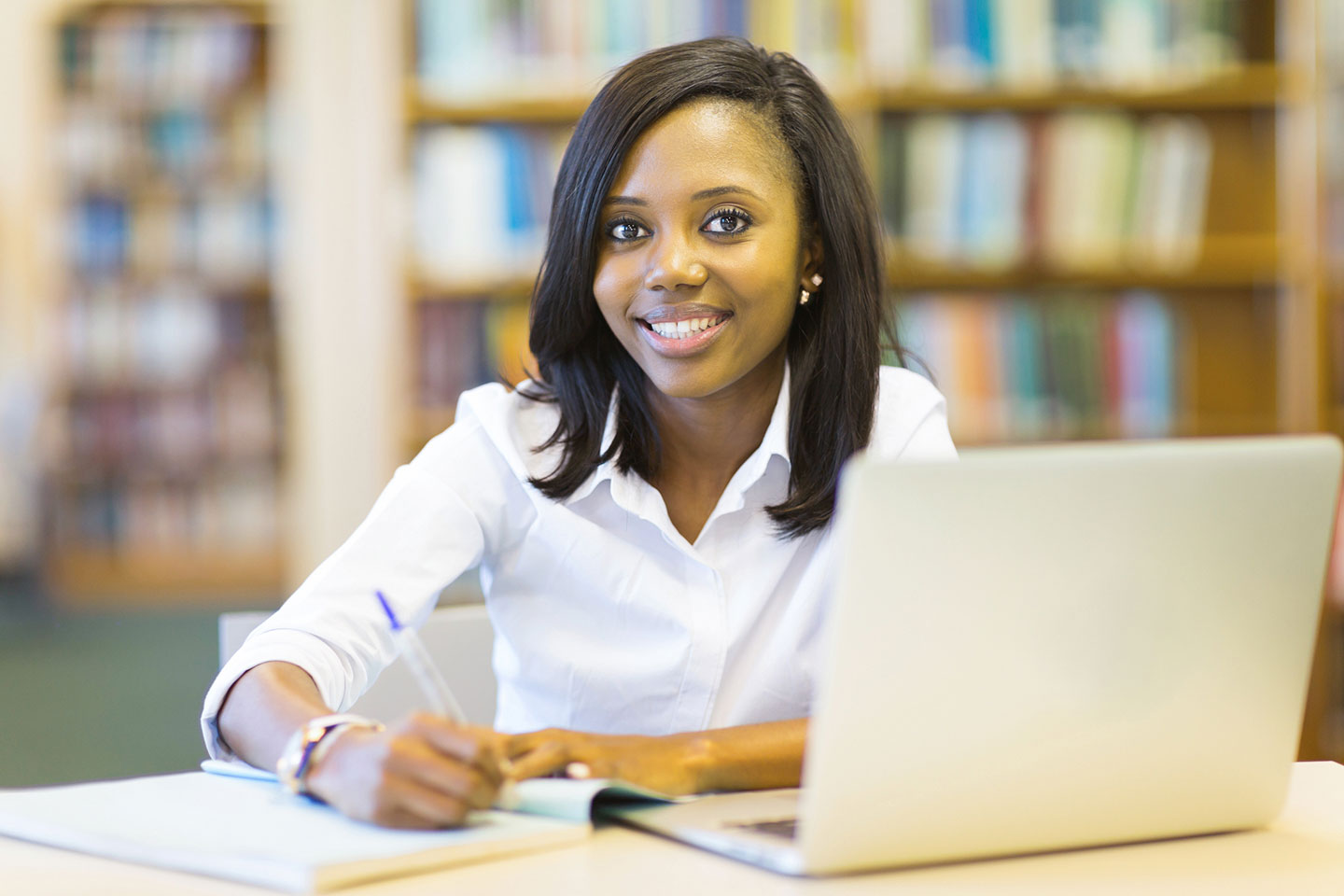 Nursing student studying in library