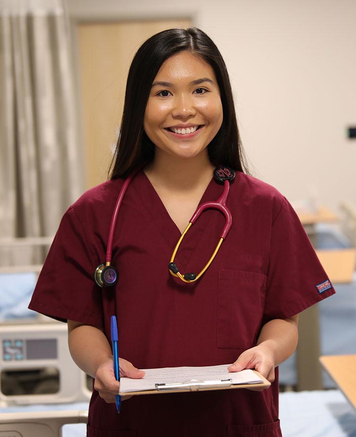 nurse standing in hospital room